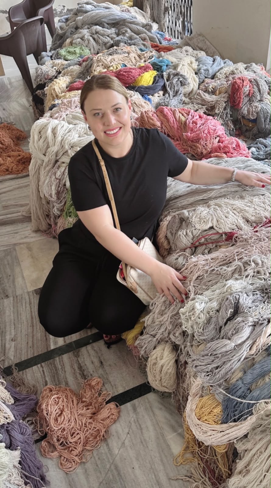Leah selecting colourful yarn during a Zoya sourcing trip