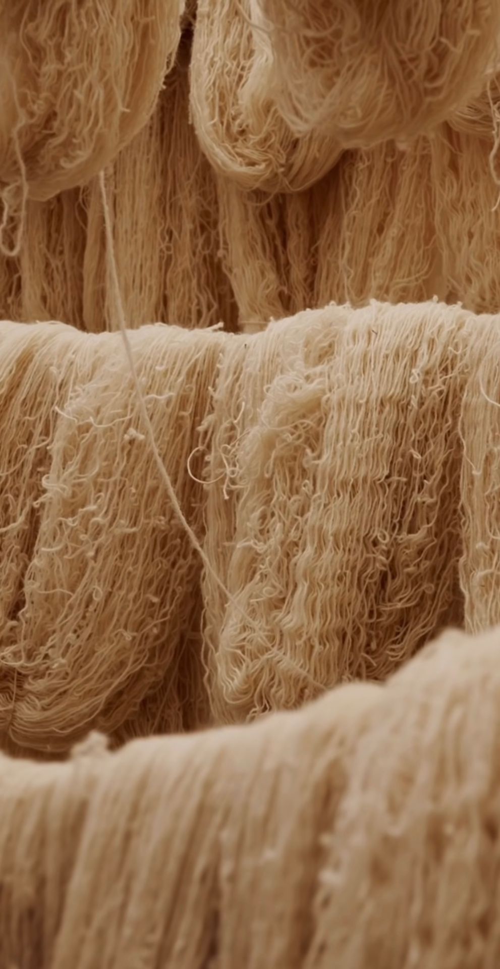 Natural wool yarn skeins prepared for hand weaving